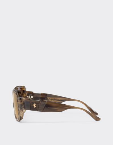 Limited-edition sunglasses in green-striped acetate, ‘  ’ by Takiron, with green gradient lenses and an 18-carat gold Prancing Horse