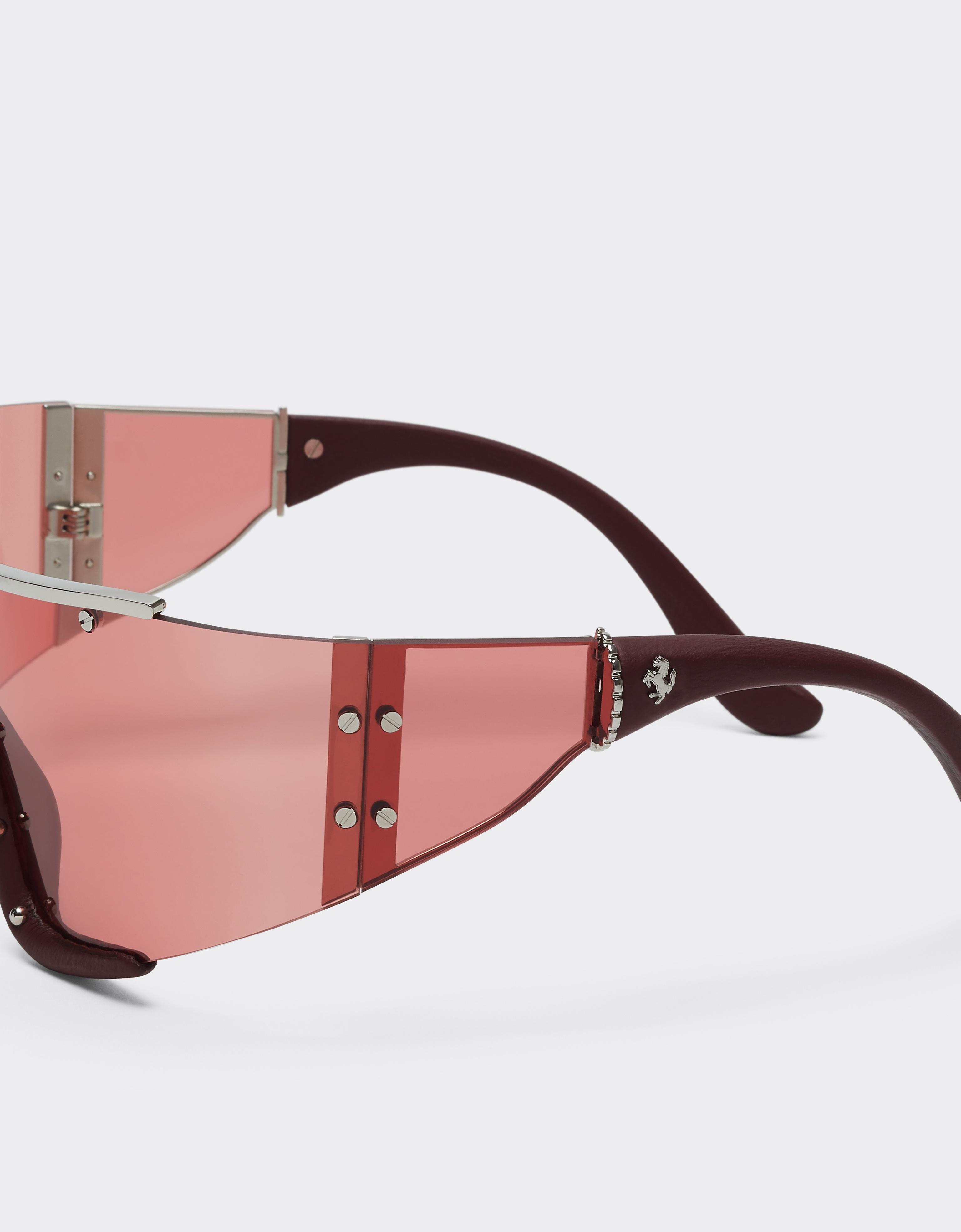 Ferrari sunglasses in metal and red leather with a red frame