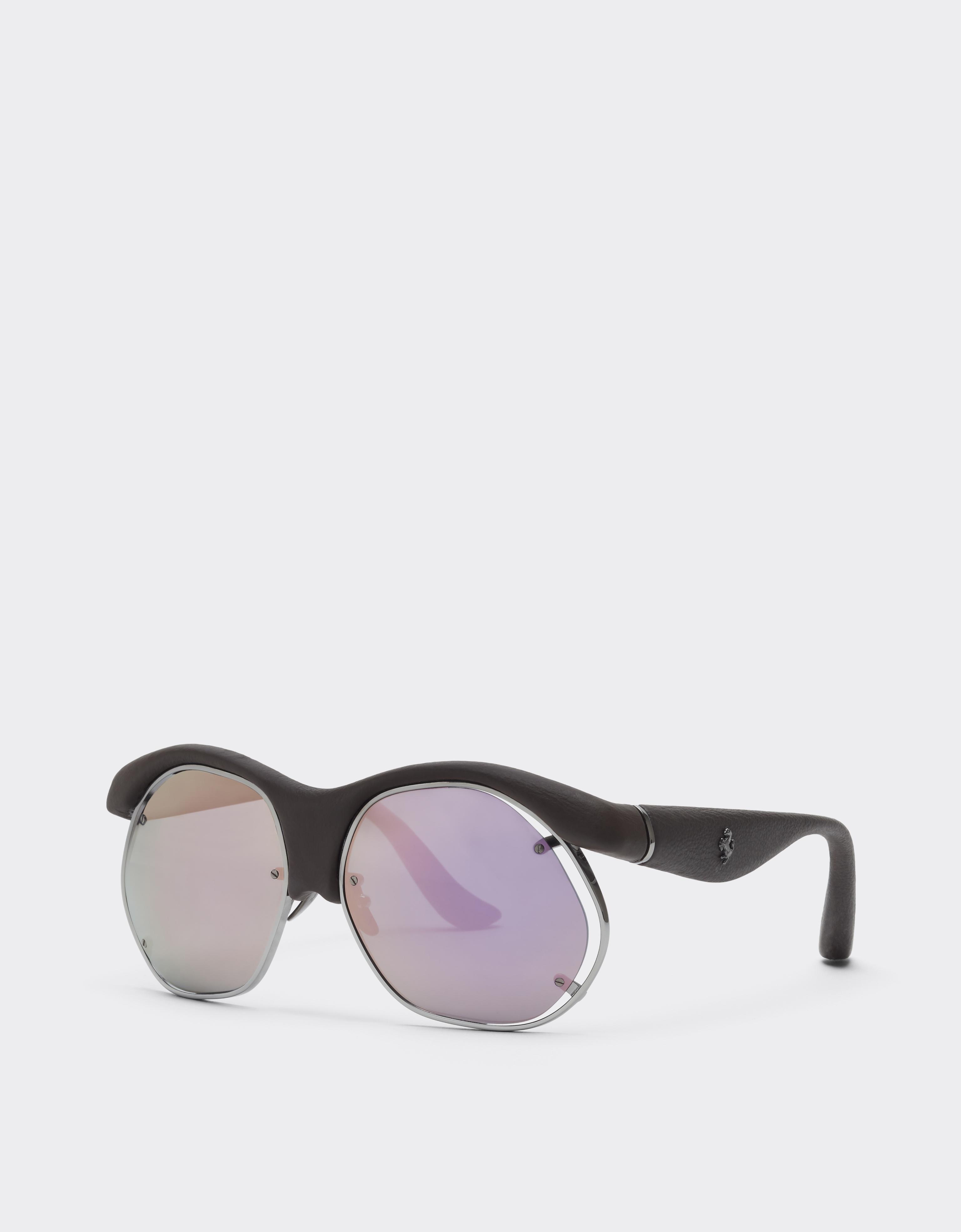 Injection-moulded sunglasses in metal and dark brown leather with grey lenses featuring a pink mirror finish