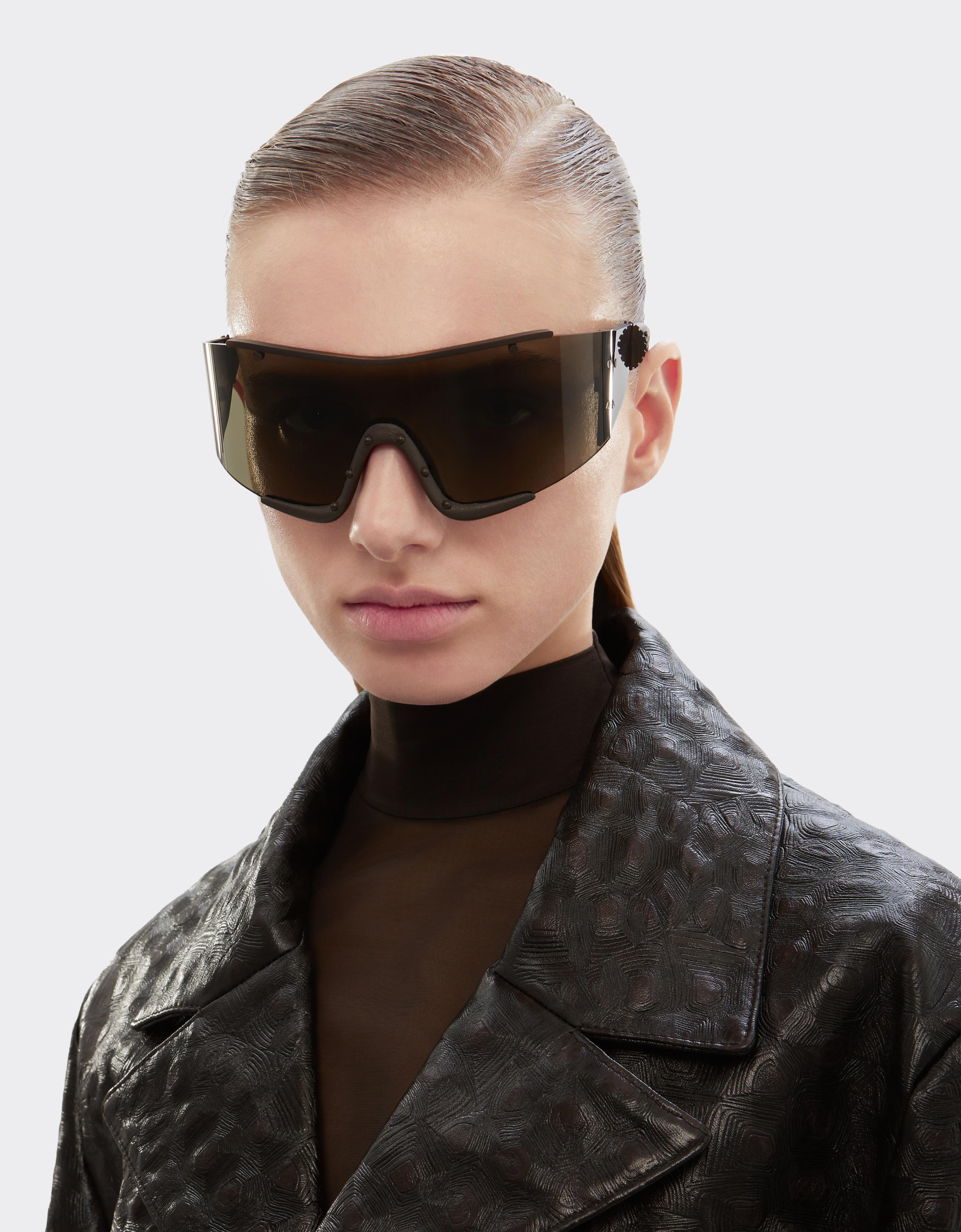 Ferrari sunglasses in metal and brown leather with a brown frame