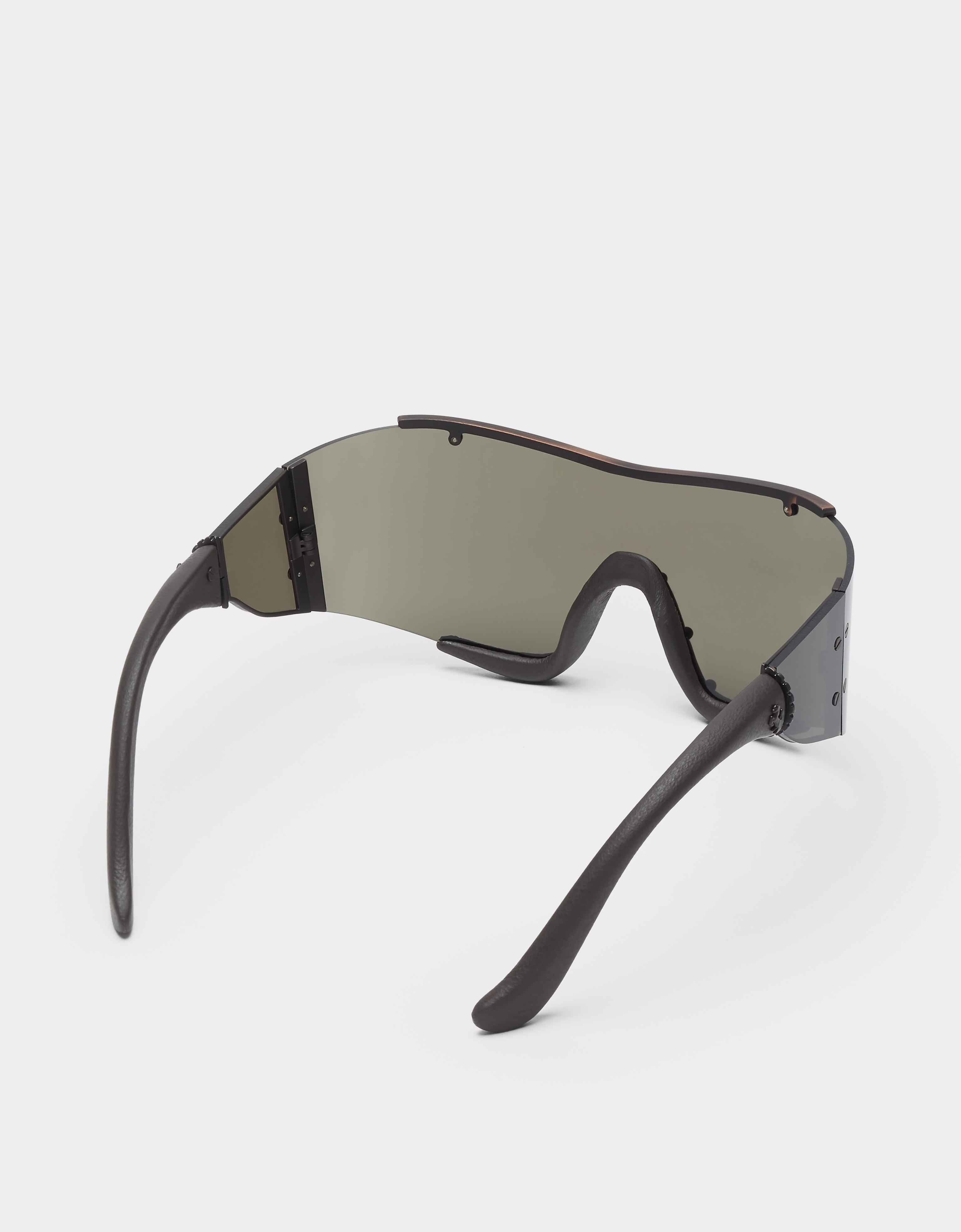 Ferrari sunglasses in metal and brown leather with a brown frame