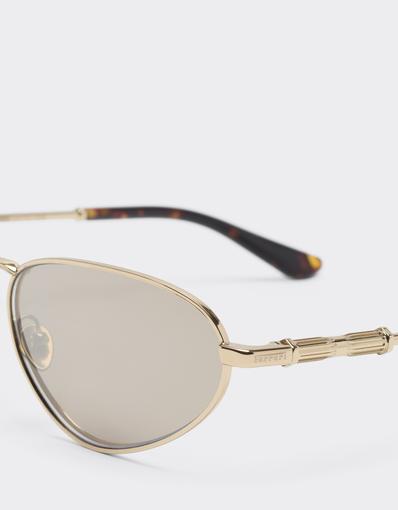 Lunettes de soleil en métal doré avec verres blancs à effet miroir doré