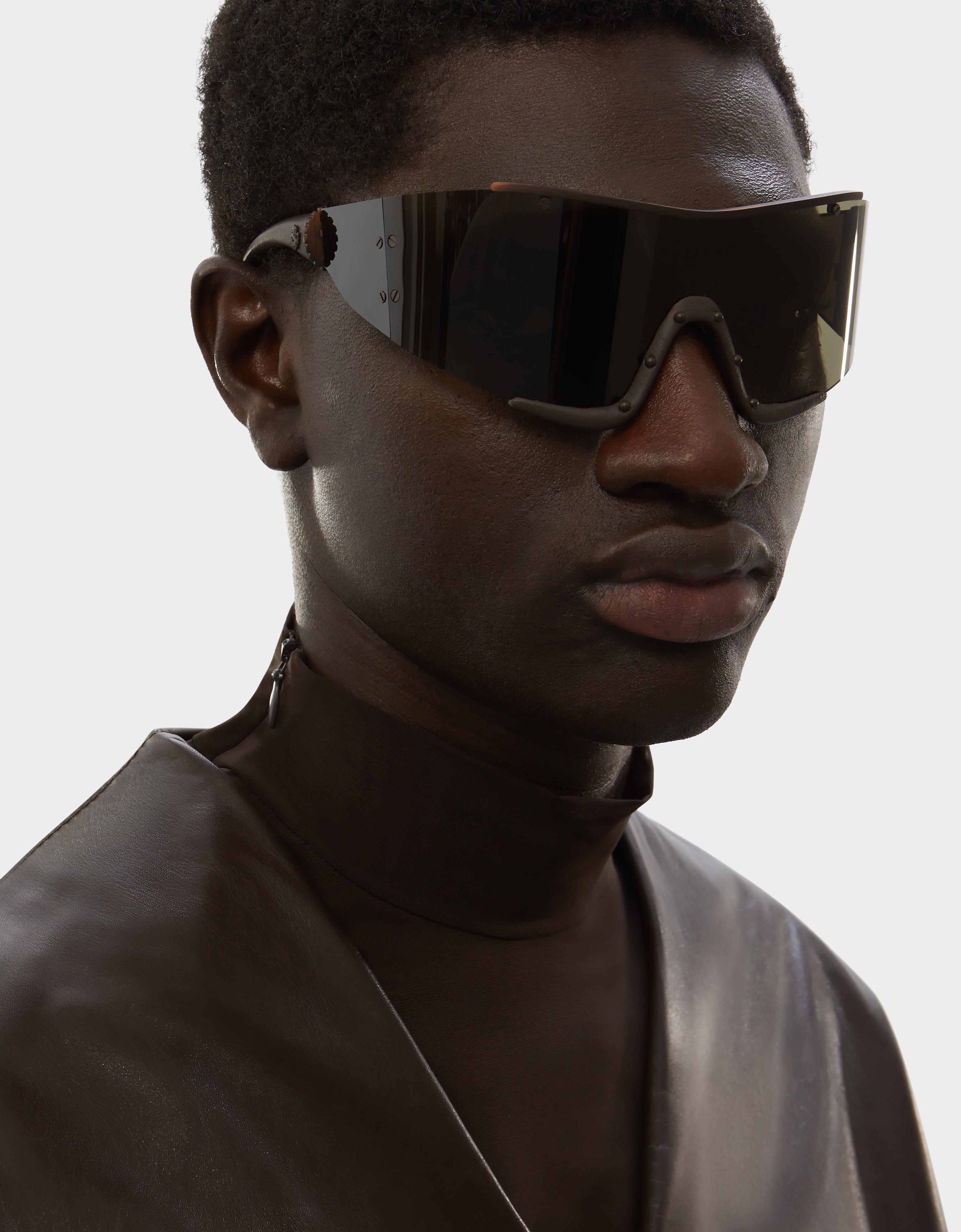 Ferrari sunglasses in metal and brown leather with a brown frame