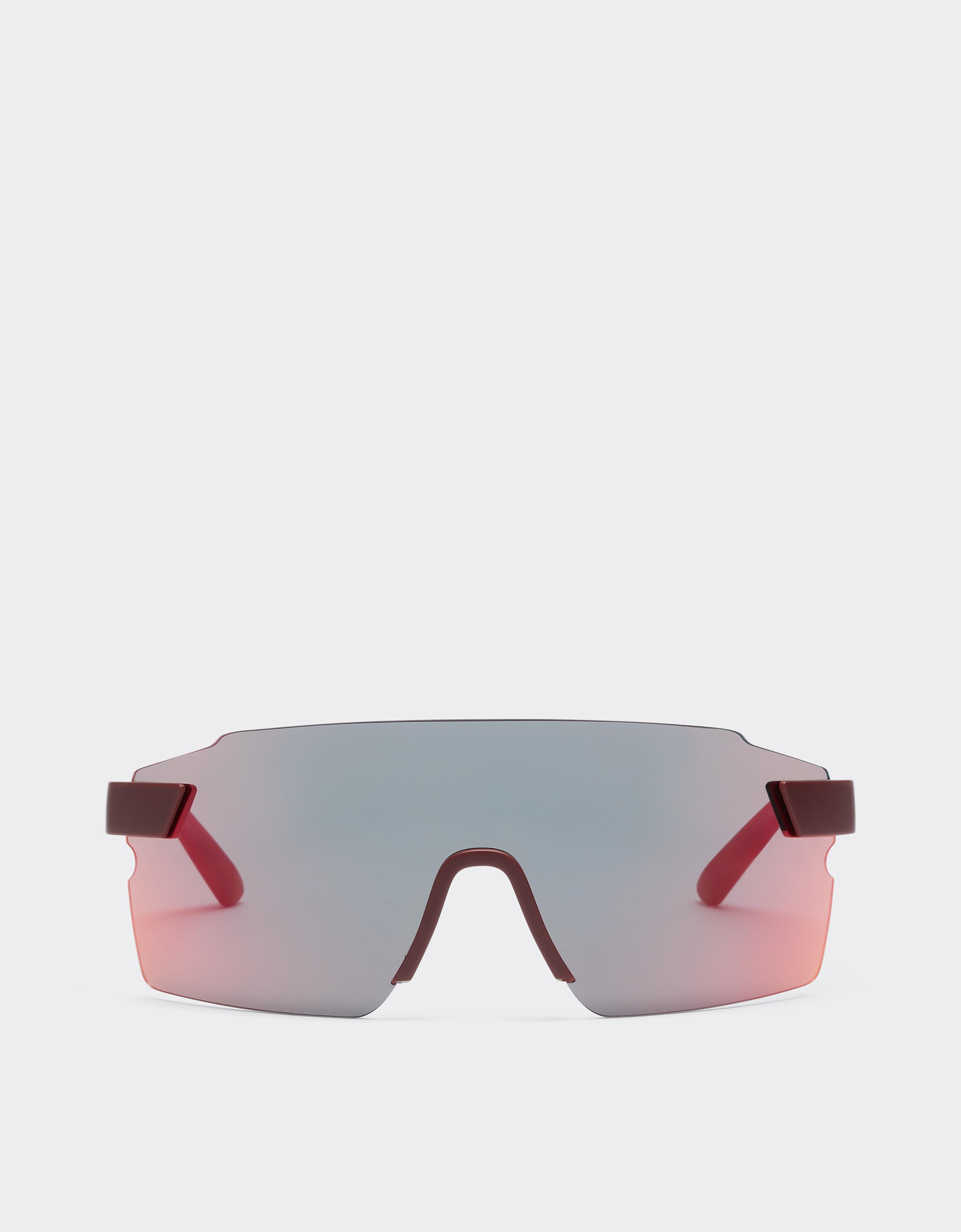 Scuderia Ferrari 0FZ6024 Sonnenbrille aus Spritzguss mit dunkelgrau verspiegelt rot/gelben Gläsern.