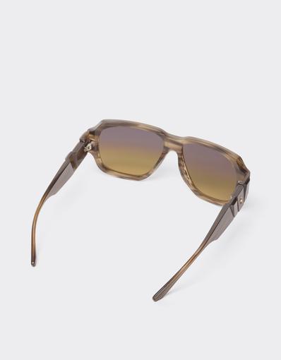 Limited-edition sunglasses in green-striped acetate, ‘  ’ by Takiron, with green gradient lenses and an 18-carat gold Prancing Horse
