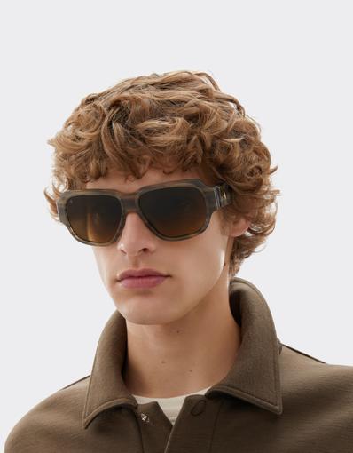 Limited-edition sunglasses in green-striped acetate, ‘  ’ by Takiron, with green gradient lenses and an 18-carat gold Prancing Horse