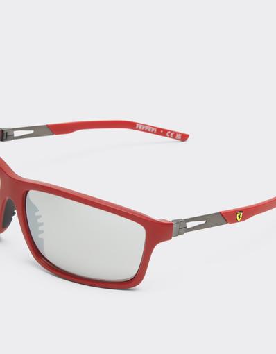 Scuderia Ferrari 0FZ6021 sunglasses in matte Ferrari red injected and metal with mirrored grey lenses.