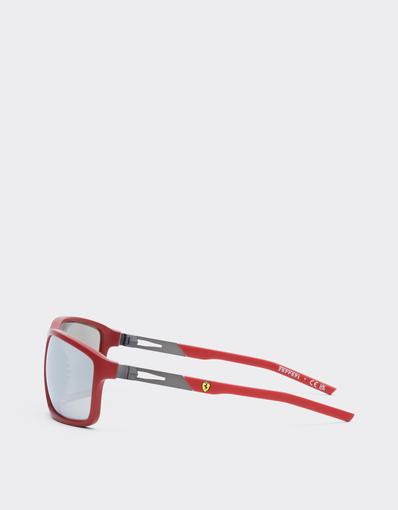 Scuderia Ferrari 0FZ6021 sunglasses in matte Ferrari red injected and metal with mirrored grey lenses.