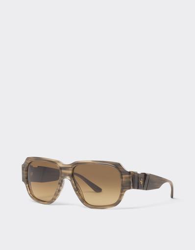 Limited-edition sunglasses in green-striped acetate, ‘  ’ by Takiron, with green gradient lenses and an 18-carat gold Prancing Horse