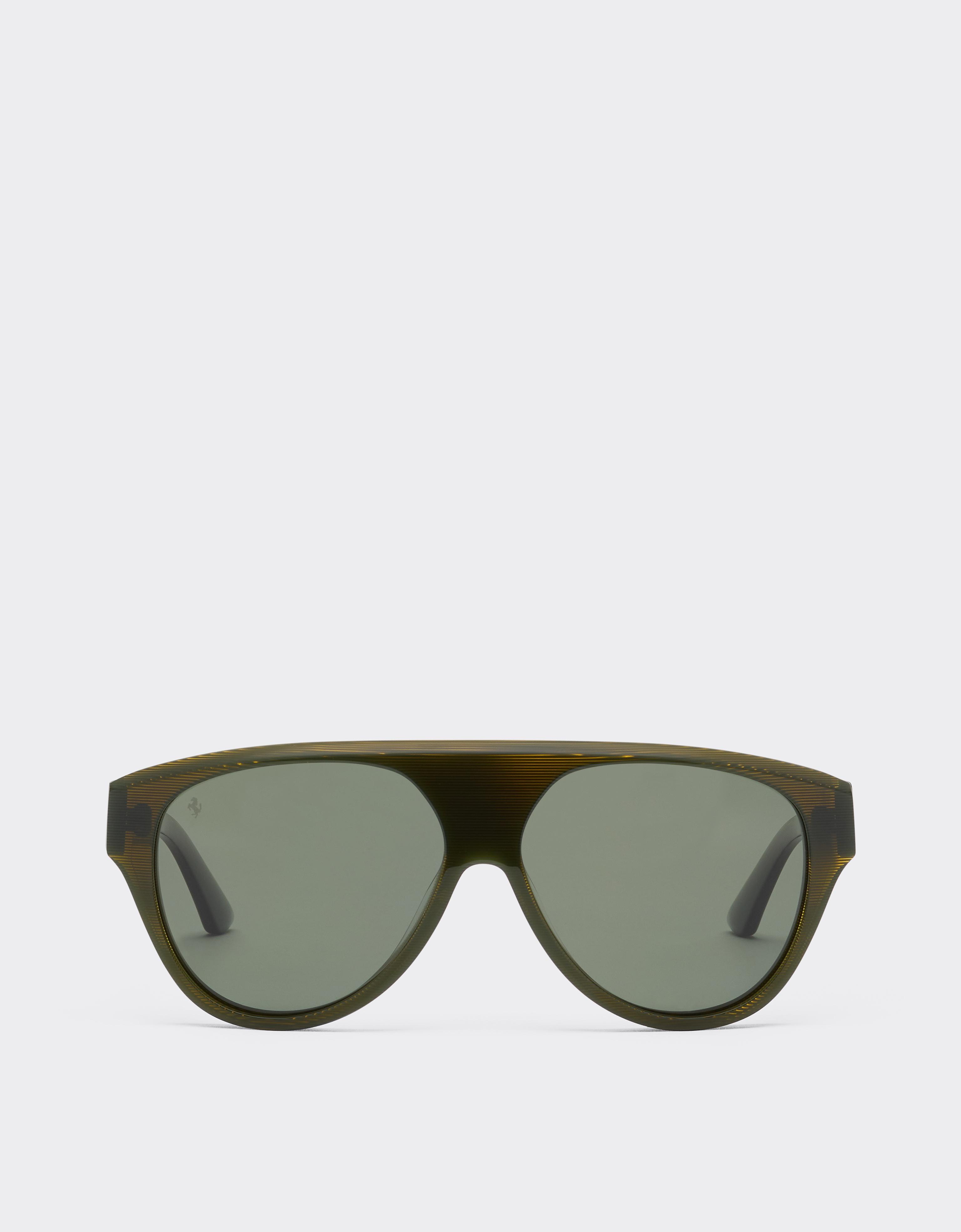 Sunglasses in striped green acetate with green polarised lenses