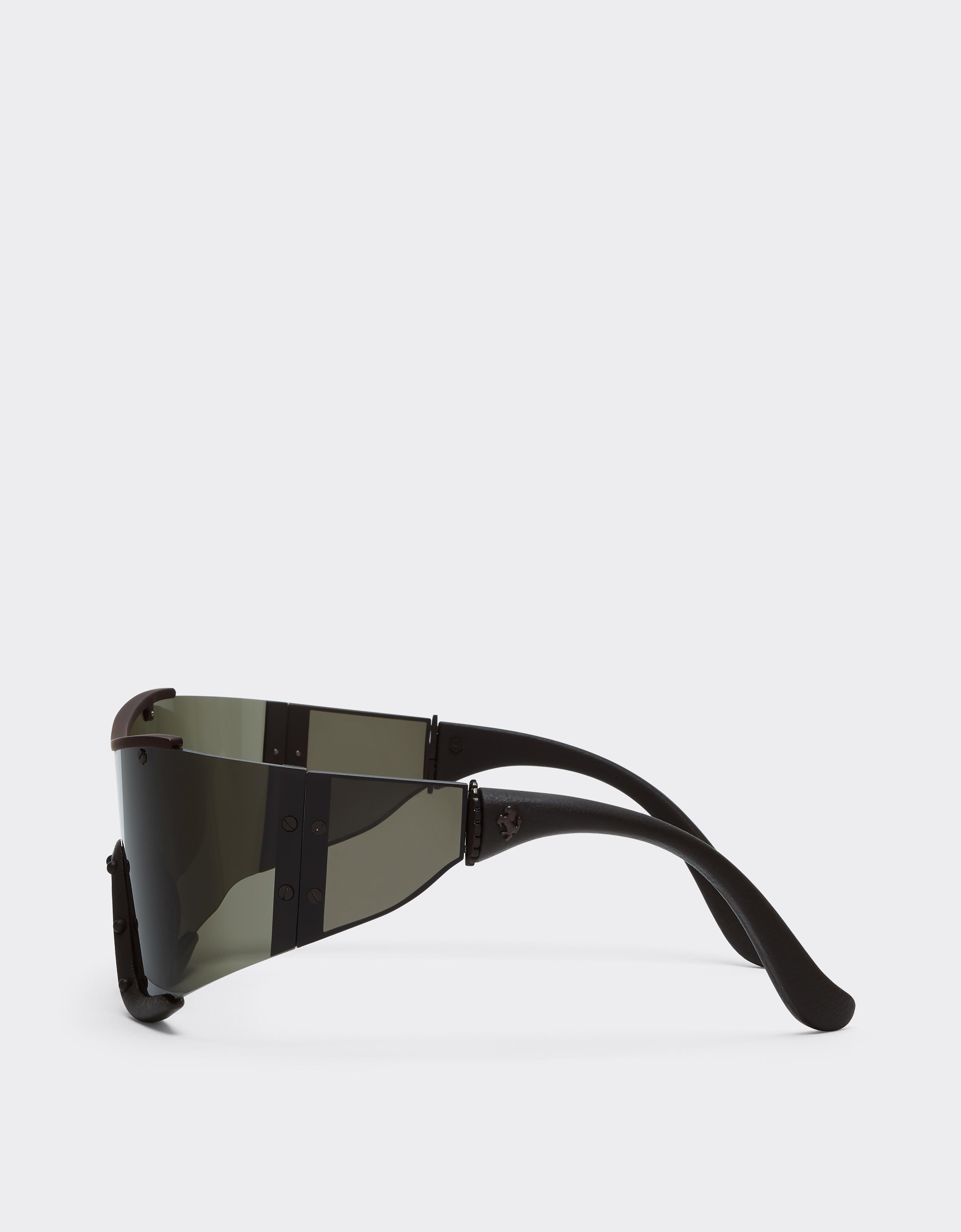 Ferrari sunglasses in metal and brown leather with a brown frame